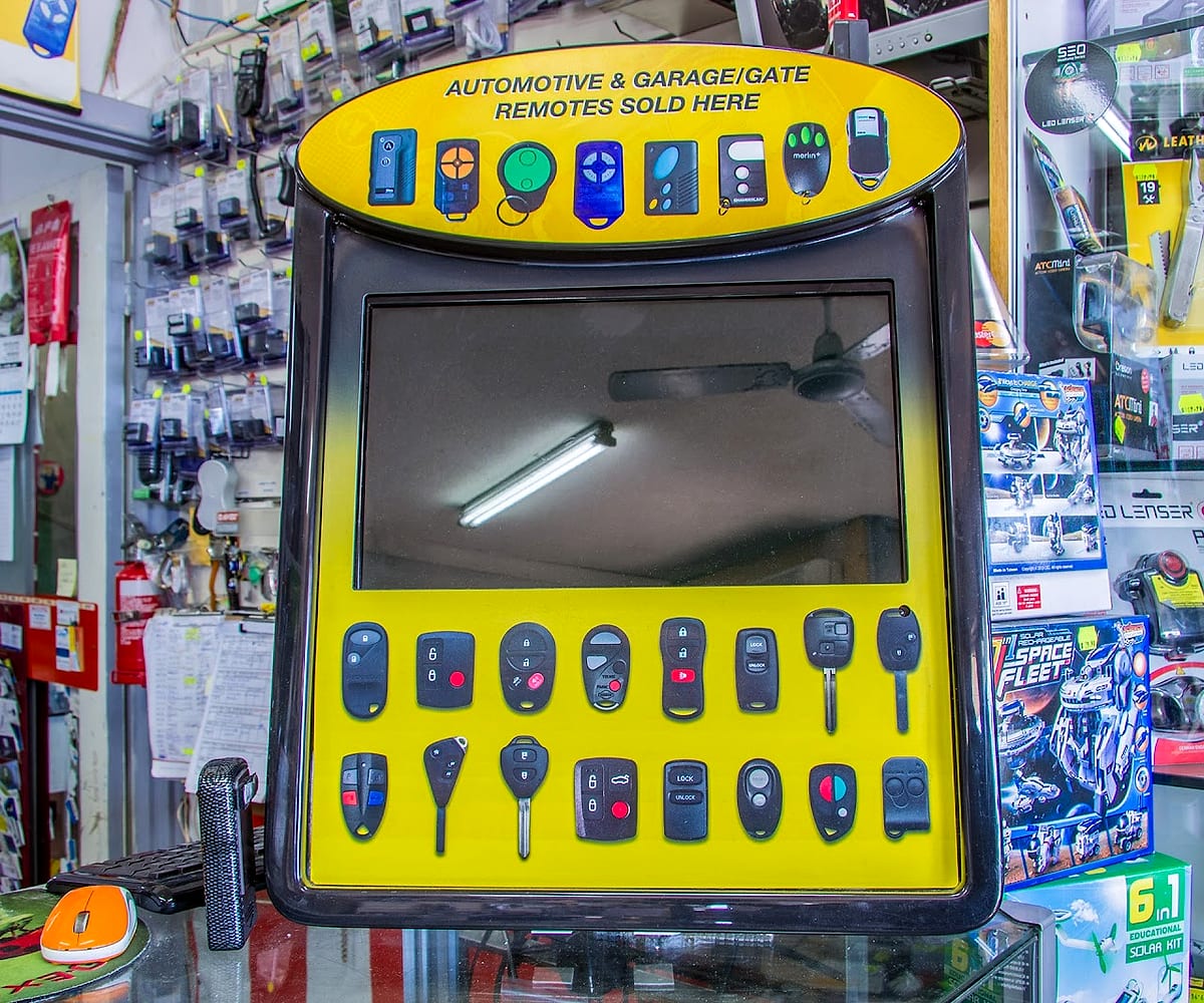 The remote and key display board in store, showing car and garage remotes stocked
